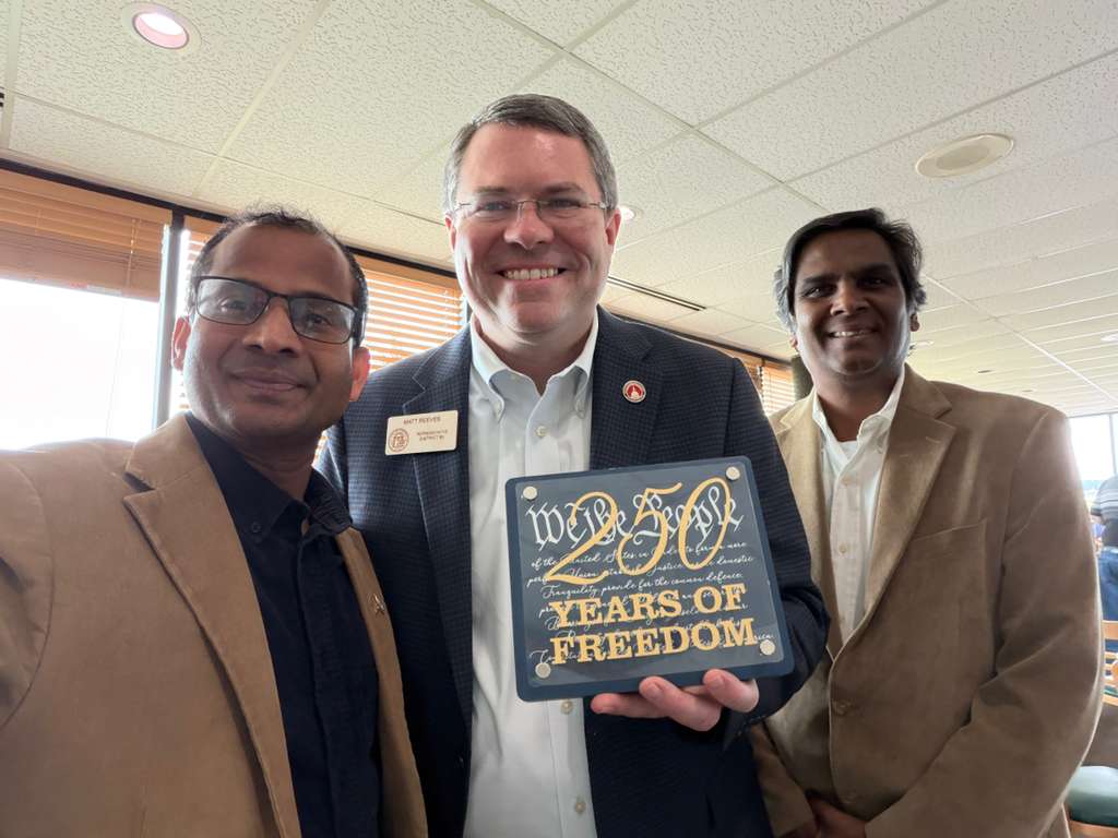 Ravi Mandadi with local community partners